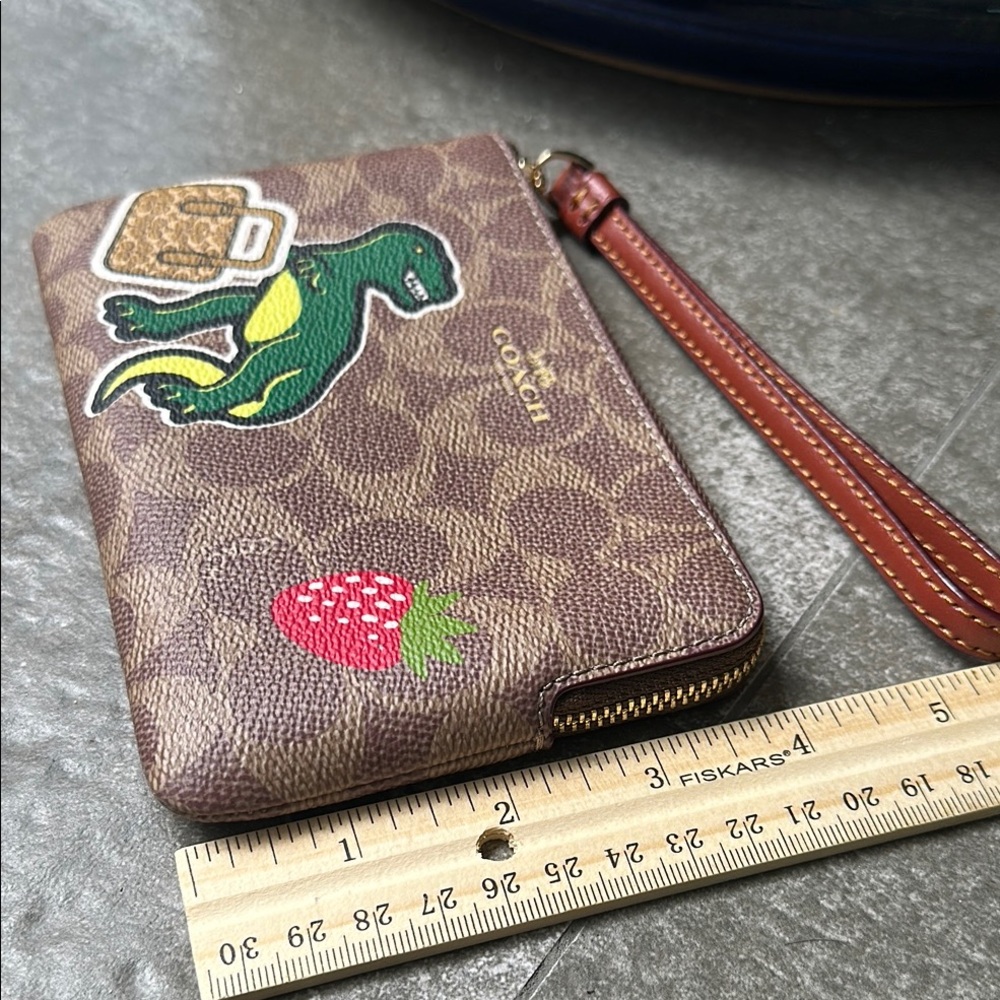 Coach Brown Wristlet with Dinosaur and Strawberry Patches - Picture 11 of 13